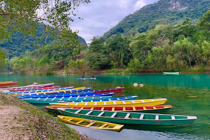 Tamul waterfall and water cave on a wooden canoe