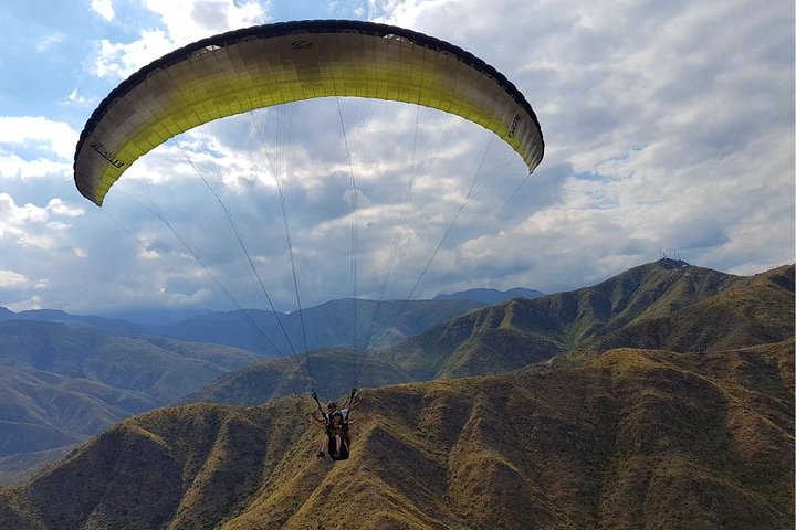 Paragliding free flight experience over the pre-range