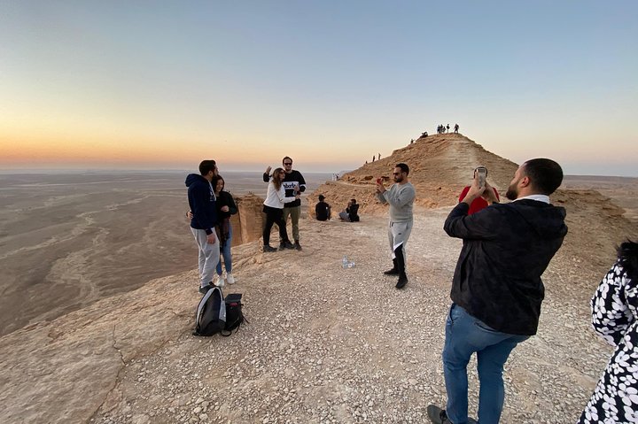 Edge of the World with 4x4 vehicle, camels and stargazing