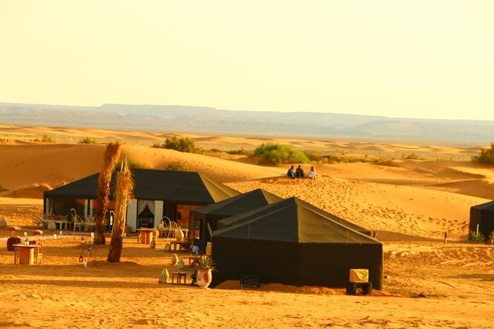 Merzouga: Overnight in luxury desert camp with Camel Ride, meals & sandboarding