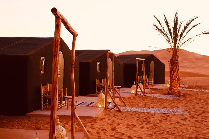 Merzouga: Overnight in luxury desert camp with Camel Ride, meals & sandboarding