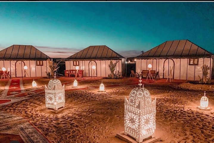 Merzouga: Overnight in Luxury Desert Camp with Camel Ride, meals & sandboarding
