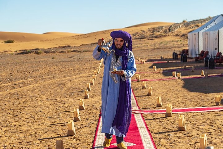 Merzouga: Overnight in Luxury Desert Camp with Camel Ride, meals & sandboarding