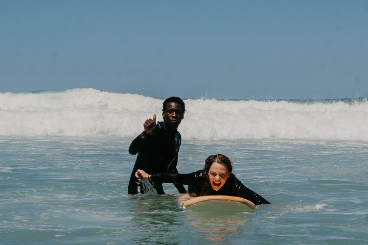 1h15min surfing lessons in Victoria Bay & Wilderness