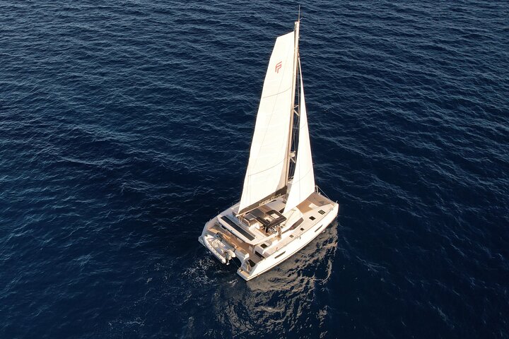 Mykonos: Brand-New Catamaran Cruise with Meal, Drinks & Transport