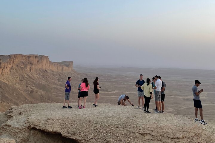 Edge of the World with 4x4 vehicle, camels and stargazing