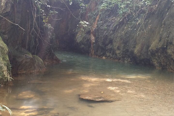 Hiking through Falan's ruins, ecotourism, river and canopy.