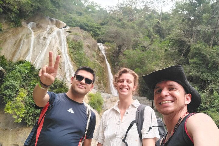 Natural adventure with waterfalls, trails and sunny day