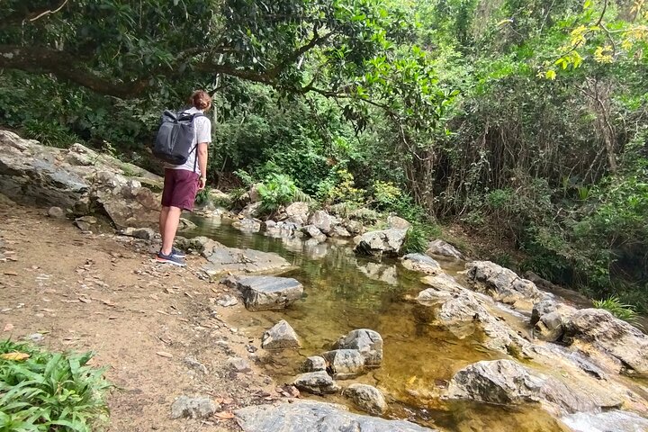 Natural adventure with waterfalls, trails and sunny day