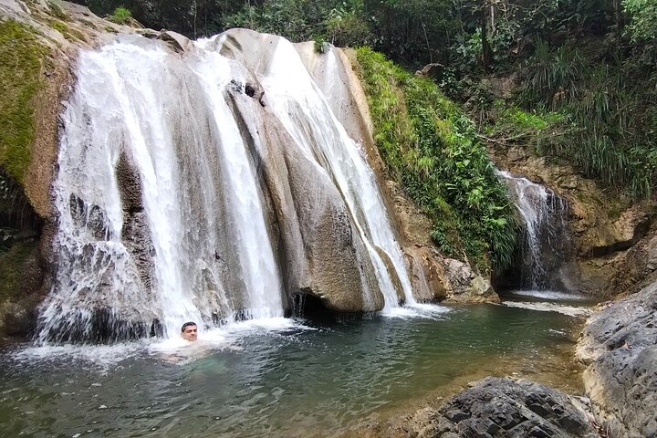 Natural adventure with waterfalls, trails and sunny day