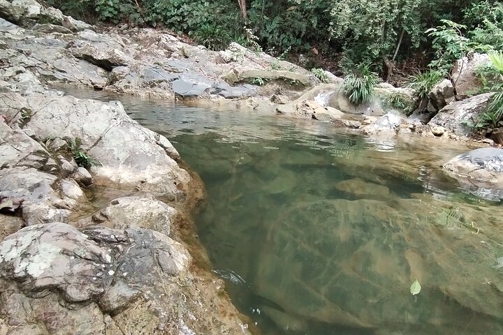 Natural adventure with waterfalls, trails and sunny day