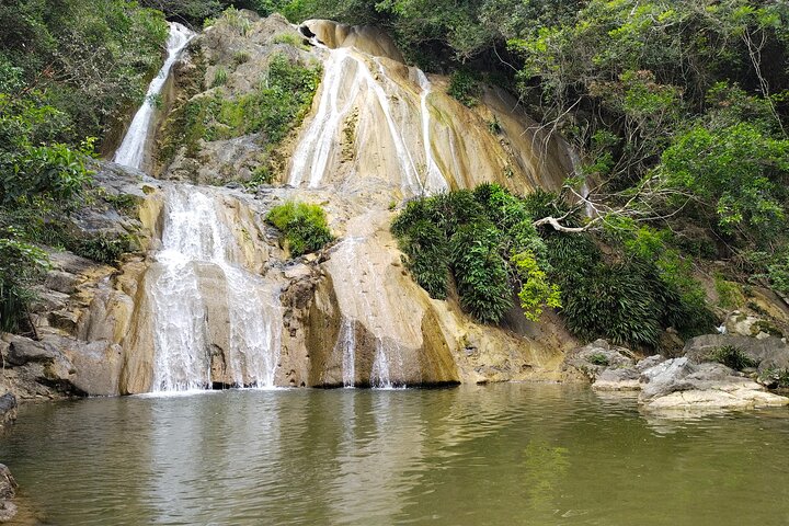 Natural adventure with waterfalls, trails and sunny day