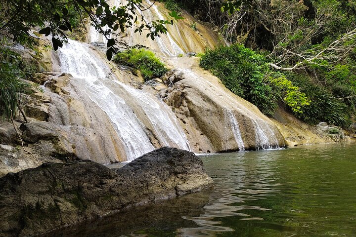 Natural adventure with waterfalls, trails and sunny day