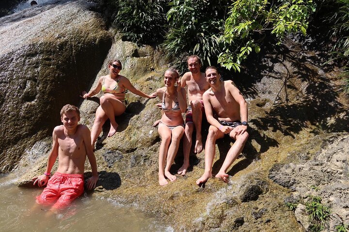Natural adventure with waterfalls, trails and sunny day