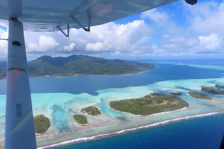 Private flight, in a light plane over the Polynesian motus from Raiatea