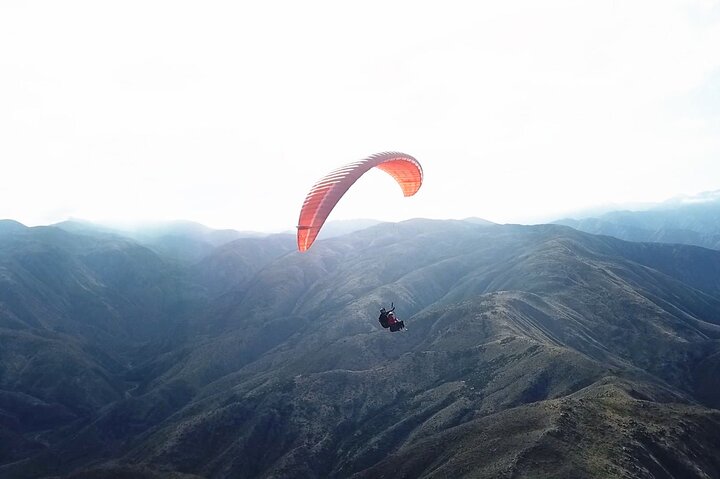 Paragliding free flight experience over the pre-range