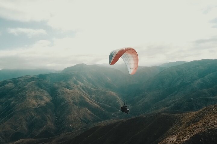 Paragliding free flight experience over the pre-range