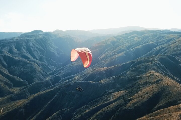 Paragliding free flight experience over the pre-range