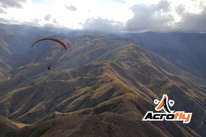 Paragliding free flight experience over the pre-range