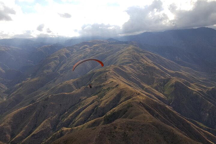 Paragliding free flight experience over the pre-range