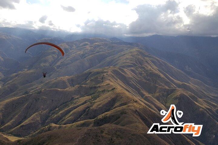 Paragliding free flight experience over the pre-range
