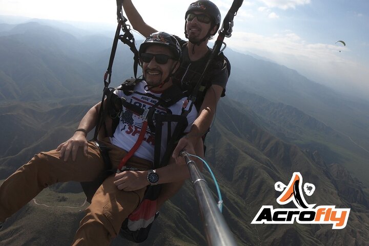 Paragliding free flight experience over the pre-range