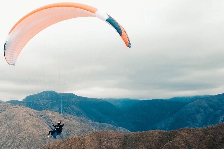 Paragliding free flight experience over the pre-range