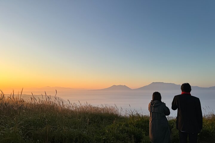 View the sunrise and sea of clouds over the Aso Caldera