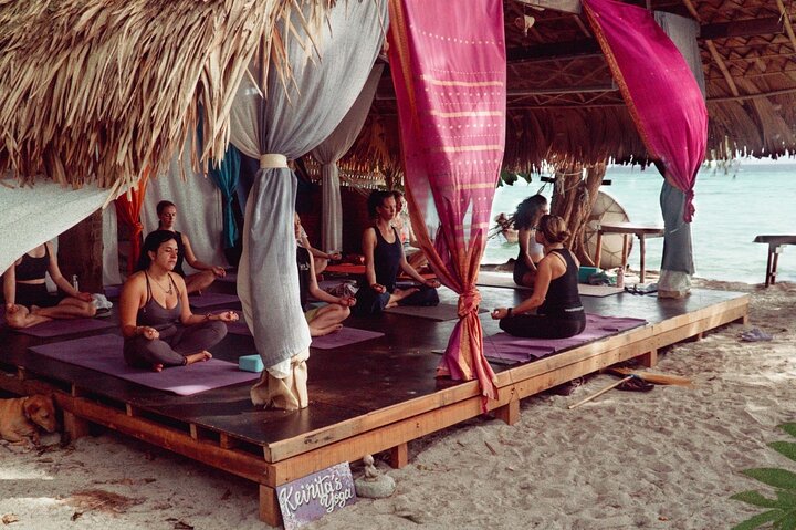 Sunrise yoga class overlooking the beach, the sea & sunrise .