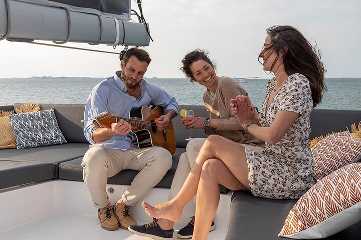 Mykonos: Brand-New Catamaran Cruise with Meal, Drinks & Transport