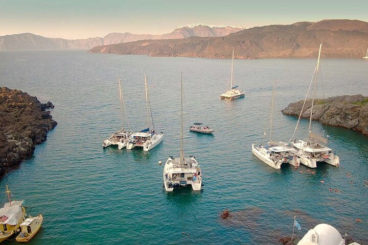 Santorini Catamaran Cruise with Swim-Stops, Greek Meal and Sunset