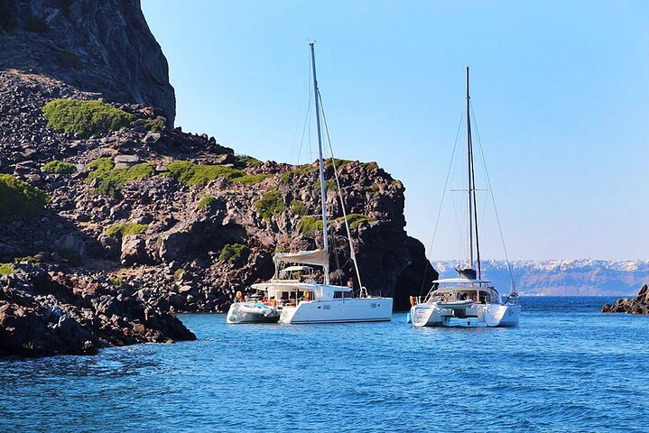 Santorini Catamaran Cruise with Swim-Stops, Greek Meal and Sunset