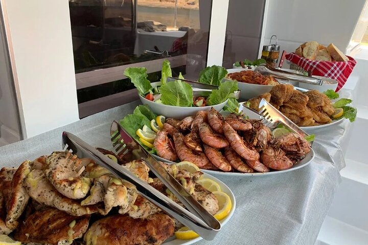 Santorini Catamaran Cruise with Swim-Stops, Greek Meal and Sunset