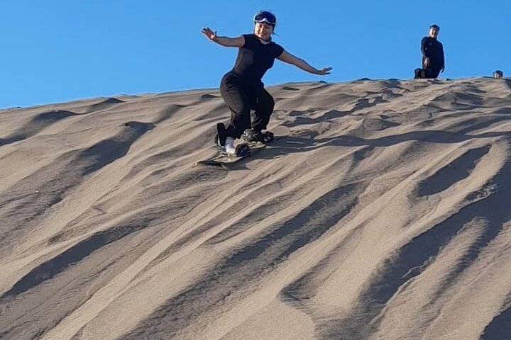 Sandboarding in the Mogote Sand Dunes in La Paz