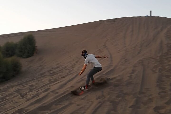Sandboarding in the Mogote Sand Dunes in La Paz