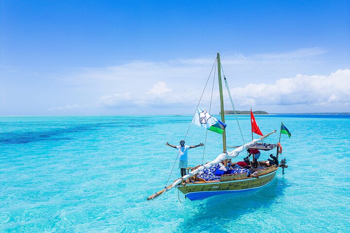 Exclusive private full-day Dhow sail & snorkel Mnemba sandbank