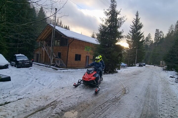 Day Tour from Bucharest-Carpathian Snowmobile Experience