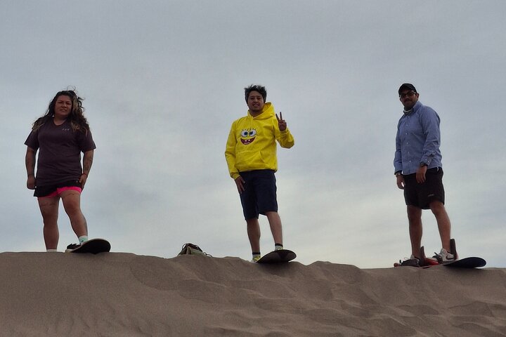 Sandboarding in the Mogote Sand Dunes in La Paz