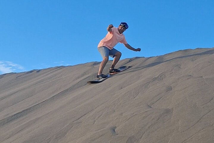 Sandboarding in the Mogote Sand Dunes in La Paz