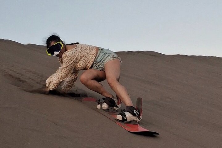 Sandboarding in the Mogote Sand Dunes in La Paz