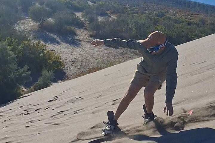 Sandboarding in the Mogote Sand Dunes in La Paz