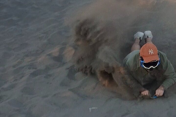 Sandboarding in the Mogote Sand Dunes in La Paz