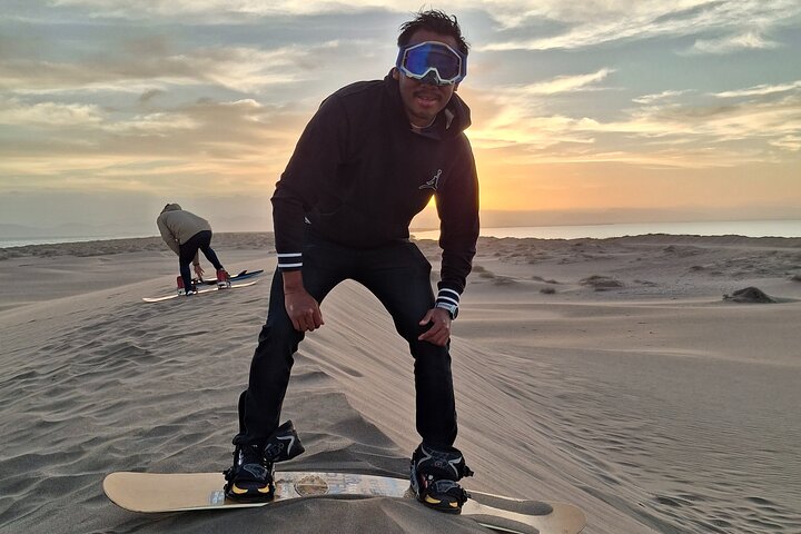 Sandboarding in the Mogote Sand Dunes in La Paz