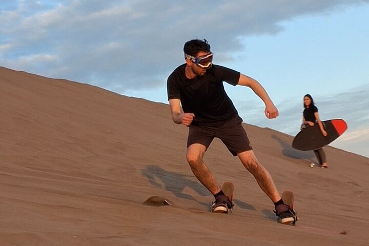 Sandboarding in the Mogote Sand Dunes in La Paz