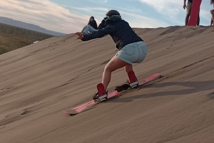 Sandboarding in the Mogote Sand Dunes in La Paz