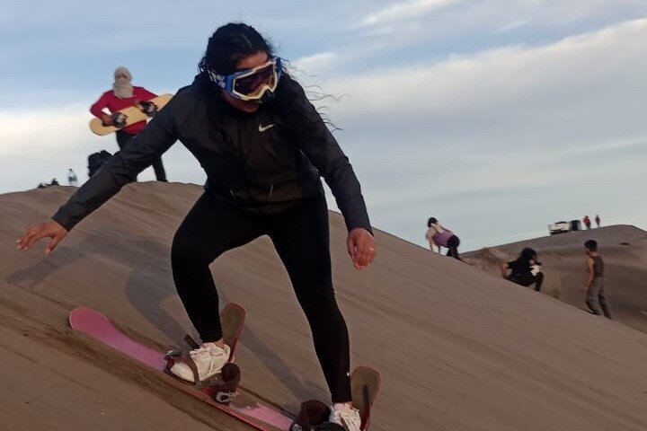 Sandboarding in the Mogote Sand Dunes in La Paz