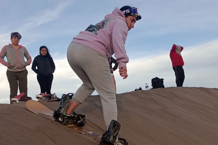 Sandboarding in the Mogote Sand Dunes in La Paz
