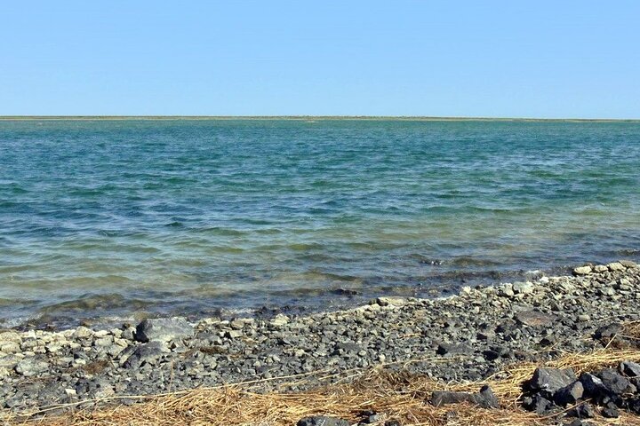 Experience a Breathtaking Sunset at Aral Sea with Friendly People
