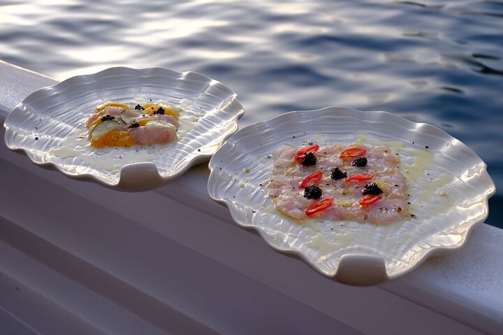 Private Cruise: Explore Rina’s Cave & Enjoy Fresh Seafood Onboard