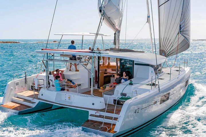 Santorini Catamaran Cruise with Swim-Stops, Greek Meal and Sunset